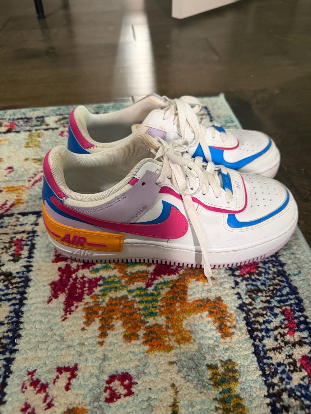 Nike White Sneakers with Pink, Blue, Purple & Yellow Accents
